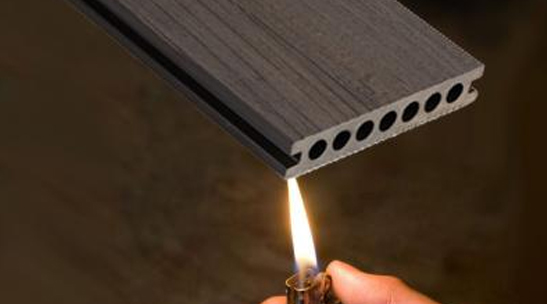 Flame retardant co-extruded wood-plastic profiles